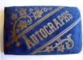 Isolated closeup antique blue velvet autograph book front cover