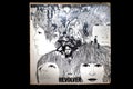 Isolated Closeup of Front of Worn Out The Beatles Revolver Vinyl Album Cover