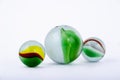 Isolated closeup of glass marbles on white background Royalty Free Stock Photo