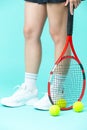 Isolated Closeup on Legs of Caucasian Female Tennis Player Grasping Tennis Ball With Racket Royalty Free Stock Photo