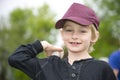 Isolated closeup portrait of a young blonde caucasian boy playing baseball Royalty Free Stock Photo