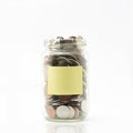 Isolated coins in jar.