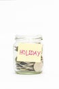 Isolated coins in jar with holiday label Royalty Free Stock Photo