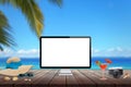 Isolated computer display on wooden table for mockup. Beach, sea, palm and blue sky in background. Royalty Free Stock Photo