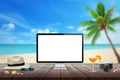 Isolated computer display on wooden table for mockup. Beach, sea, palm and blue sky in background. Royalty Free Stock Photo