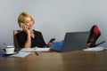 Isolated corporate business portrait of young beautiful and happy woman with blonde hair smiling while working relaxed at office l