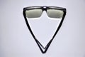 Isolated corrective vision glasses in abstract top view. Strong shadows. White background.
