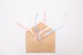 Craft paper envelope pink blue white ribbons white background Royalty Free Stock Photo