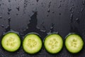 Isolated cucumber slices. Pieces of fresh cucumber isolated on black background Royalty Free Stock Photo