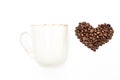 isolated cup of coffee and heart made of coffee beans Royalty Free Stock Photo