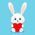 Isolated cute and sweet white bunny rabbit in sitting pose with red heart