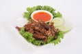 Isolated deep fried beef slice with herbs with delicious taste on white background