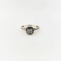 Bride`s bright and sparkly diamond and white gold engagement ring in front of a white background Royalty Free Stock Photo