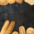 Isolated different kinds of bread on a black background. Photo of variety of bread with copy space. Top view. Related to bakery Royalty Free Stock Photo
