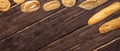 Isolated different kinds of bread on a wooden background. Photo of variety of bread with copy space. Top view. Related to bakery Royalty Free Stock Photo