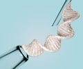 Isolated DNA helix strand with syringe and pipet Royalty Free Stock Photo