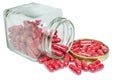 Isolated dusted expired old red capsule Royalty Free Stock Photo