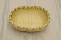 empty breadbasket. Handmade wicker tray with nice pattern border Royalty Free Stock Photo