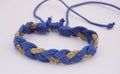 An isolated ethnic bracelet on white background. The bracelet is made off the various rope