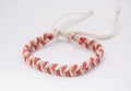 An isolated ethnic bracelet on white background. The bracelet is made off the various rope