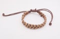 An isolated ethnic bracelet on white background. The bracelet is made off the various rope