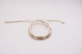 An isolated ethnic bracelet on white background. The bracelet is made off the various rope