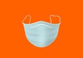 Isolated face mask in the middle on a orange background