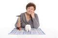 Isolated female pensioner killing her piggy bank.