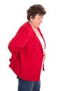 Isolated female senior in red has backache or rheumatism.