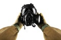 Isolated first person view military hands holding gas mask