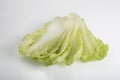  flat lay shot of a pile of Chinese napa cabbage leaves on a white background