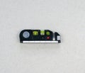 Flexible ruler with building spirit level isolated on a light background. Close up surface alignment tool.