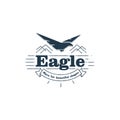 Isolated flying eagle silhouette vector logo.