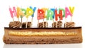 Half Cake with Happy Birthday Candles on white Background - Isolated Royalty Free Stock Photo