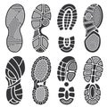 Isolated footprint vector silhouettes. Dirty shoes and sneakers footprints