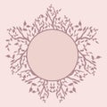 Isolated frame with soft lilac branches with leaves on a soft pinck background stylized with a circle for text