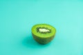 Isolated fresh and juicy green kiwi fruit on green pastel colour Royalty Free Stock Photo