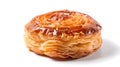 Isolated fresh, ruddy pastry lies on a white glossy surface