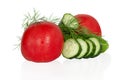 Isolated fresh vegetables. Sliced cucumbers and tomatoes with dill , salad components, isolated on a white background Royalty Free Stock Photo