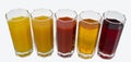 Isolated glasses of juice on white