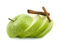 Isolated green apple slices with cinnamon pods Royalty Free Stock Photo