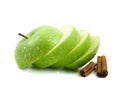 Isolated green apple slices with cinnamon pods Royalty Free Stock Photo