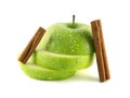 Isolated green apple slices with cinnamon pods Royalty Free Stock Photo