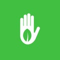 Isolated green leaf in white hand vector logo. Save nature symbol. Protect plants icon. Agricultural emblem. Organic