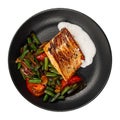 Isolated grilled salmon steak with vegetables