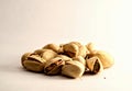 A group of pistachio nuts on white background