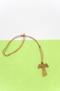 isolated hand made wooden tau cross pendant - greek letter tau