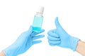 Hand with gloves uses an alcohol based liquid sanitizer or cleanser that kills most types of microbes and viruses. Covid