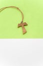 isolated hand made wooden tau cross pendant - Greek letter tau