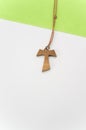 isolated hand made wooden tau cross pendant - Greek letter tau